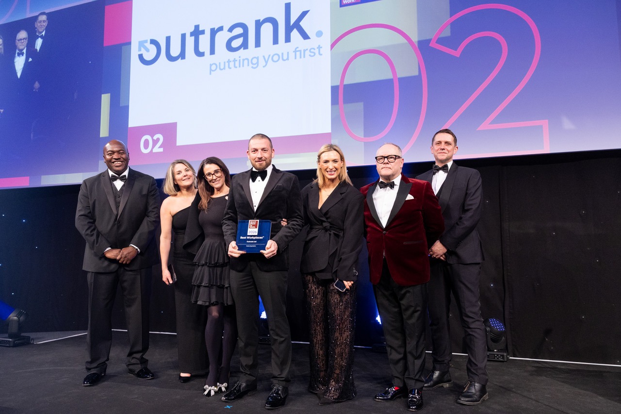 The Outrank team on stage accepting the Best Workplaces UK award